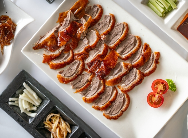 Min Jiang offering a panoramic view of Kensington Gardens and London skyline from the 10/F of the hotel.
